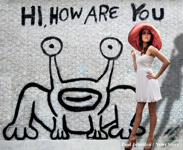 Model Ashley in front of the famous "Alien Frog" mural. This mural is located on the northwest corner of Guadalupe and 21st street in Austin. It is right across from the UT campus, diagonally across from Dobie Mall. Copyright - Paul Johnston / Austin News Story - austinnewsstory.com